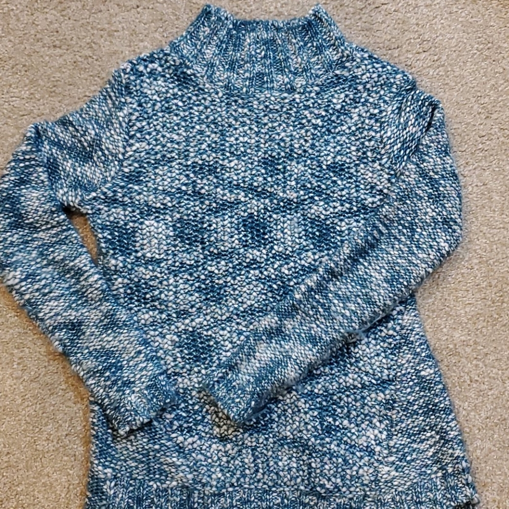 Sweater with slit opening on back